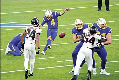  ?? JAE C. HONG / AP ?? Los Angeles Chargers kicker Mike Badgley (4) kicks a game-winning field goal during the second half of Sunday’s game against the Atlanta Falcons in Inglewood.