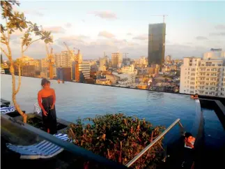  ??  ?? Marina’s stunning rooftop pool and inset below, a spacious room