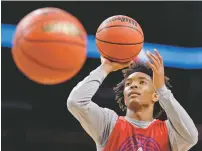  ?? PHILLIP/THE ASSOCIATED PRESS DAVID J. ?? Kansas guard Devonte’ Graham shoots during practice Friday in San Antonio. The Jayhawks (31-7) rank 11th nationally in 3-point percentage (.403) with an unusually guard-heavy lineup.