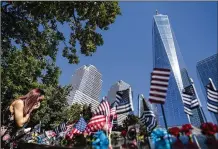  ?? JOHN MINCHILLO/ASSOCIATED PRESS ?? A mourner wipes tears from her eyes at the National September 11 Memorial & Museum in New York.