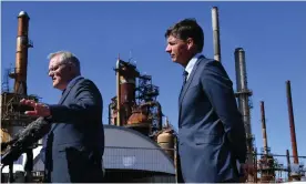  ?? Darren England/AAP ?? Australian prime minister Scott Morrison (left) and his energy minister Angus Taylor chose gas – not renewables – to fire an economic recovery from the pandemic. Photograph: