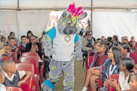  ?? ?? RECREATION and Parks mascot, Sparky, entertaini­ng the learners