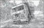  ??  ?? The charred vehicle which was allegedly torched by Maoist rebels in Chandwa, Latehar in Jharkhand on Sunday. –PTI