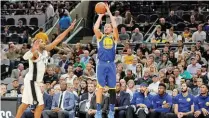  ??  ?? nba.com Golden State Warriors’ Klay Thompson (R) goes for a three-pointer against San Antonio Spurs during the NBA Western Conference fixture in San Antonio’s AT&T Center on November 2, 2017.