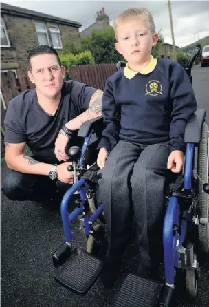  ??  ?? Seven-year-old Joshua Ashworth with his dad Brett