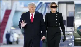  ?? MANUEL BALCE CENETA — THE ASSOCIATED PRESS ?? President Donald Trump and first lady Melania Trump arrive on Marine One before boarding Air Force One at Andrews Air Force Base, Md., on their White House departure Wednesday.