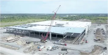  ?? GE CANADA/SUPPLIED PHOTO ?? A recent aerial photo shows work continuing on GE's Welland Brilliant Factory, on the west side of Highway 140 between Buchner Road and Silverthor­n Street. The facility is on track to be open by the end of May 2018.