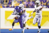  ?? Associated Press file photo ?? UConn defensive back Messiah Turner knocks the ball out of the hands of Boise State wide receiver Akilian Butler during a game earlier this season.