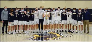  ?? OWEN MCCUE - MEDIANEWS GROUP ?? The Pope John Paul II boys basketball poses with the District 1Class 4A championsh­ip trophy after defeating New Hope Solebury on Wednesday.