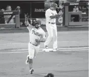  ?? MATT ROURKE AP ?? The Phillies’ Kyle Schwarber celebrates his first-inning home run in Game 3 of the NLCS on Friday night.