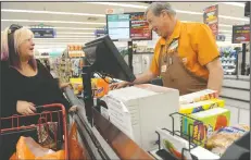  ?? BEA AHBECK/NEWS-SENTINEL ?? Save Mart employee Lee Boyer assists customer Brooke Kane of Lodi as she shops at the Lodi store on Thursday. Boyer is retiring after 45 years with the company.