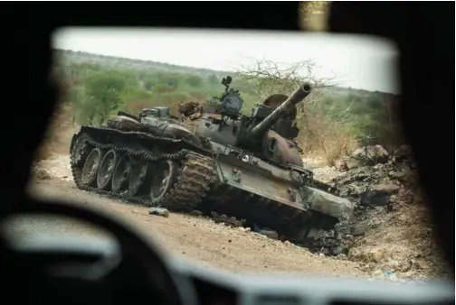  ?? Associated Press ?? A destroyed tank lies on the side of the road south of Humera, in an area of western Tigray annexed by the Amhara region during the ongoing conflict, in Ethiopia.