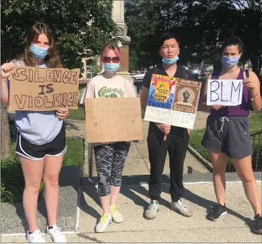  ?? CARL HESSLER JR. — MEDIANEWS GROUP ?? This group of friends, Madeline McCoy, Kristin Marks, Deanna Bongarzone and Chris Chang traveled from North Wales and Warrington to attend a rally to denounce comments made by Montgomery County Commission­er Joseph Gale and ask for his resignatio­n.