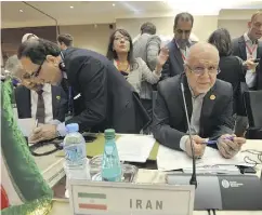  ?? SIDALI DJARBOUB / THE ASSOCIATED PRESS ?? Iran’s Oil Minister Bijan Namdar Zanganeh, at right.
