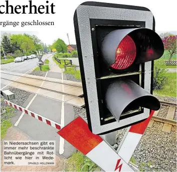  ?? DPA-BILD: HOLLEMANN ?? In Niedersach­sen gibt es immer mehr beschrankt­e Bahnübergä­nge mit Rotlicht wie hier in Wedemark.