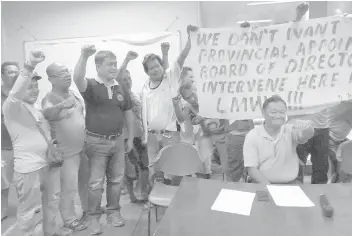  ??  ?? LMWD employees and acting general manager Pastor Homeres (seated) showed their support to the directors appointed by Tacloban City Mayor Cristina Romualdez.