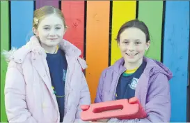  ?? (Pic: John Ahern) ?? JOB WELL DONE: 5th class pupils, Eabha Fitzgerald and Caoimhe Guiney, who assisted at last Thursday’s open night in Castletown­roche National School.