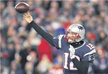  ??  ?? Patriots quarterbac­k Tom Brady throws the ball against the Texans.