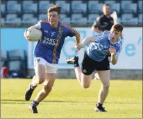  ??  ?? Gavin Fogarty keeps possession despite being pulled back by Darragh McLoughney in the Leinster Minor Football Championsh­ip in Parnell Park. Photo: Dave Barrett