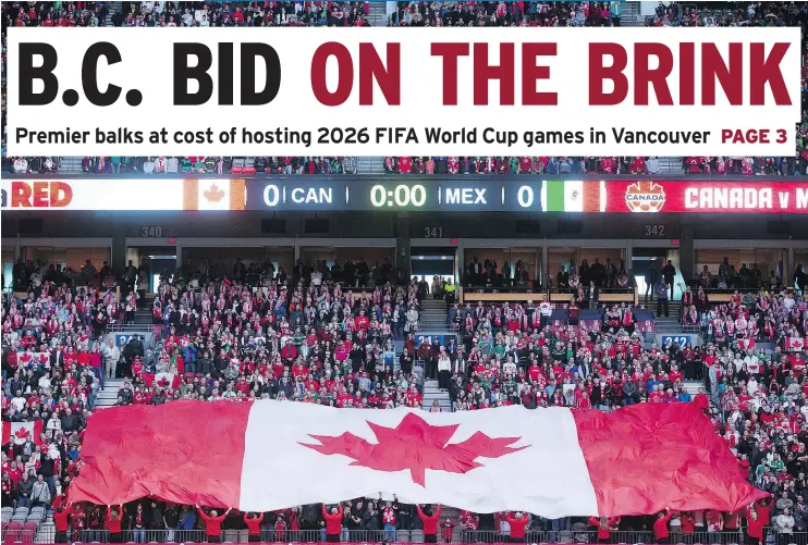  ?? — CP FILES ?? A Canadian flag is held up at a FIFA World Cup qualifying soccer match in Vancouver in 2016. B.C. is considerin­g withdrawin­g from a bid to hold 2026 games at B.C. Place.