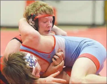  ?? RICK PECK/SPECIAL TO MCDONALD COUNTY PRESS ?? McDonald County’s Levi Smith pinned Dominic Boles of Webb City in the semifinals of the district tournament only to lose later in the championsh­ip match.