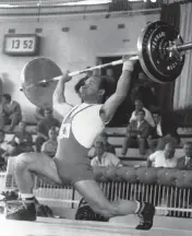  ?? AP ?? Britain’s Ben Helfgott makes a 100-kilogram snatch during the lightweigh­t weightlift­ing event at the Summer Olympics in Rome in September 1960. The Polish-born Jew survived a Nazi death camp.