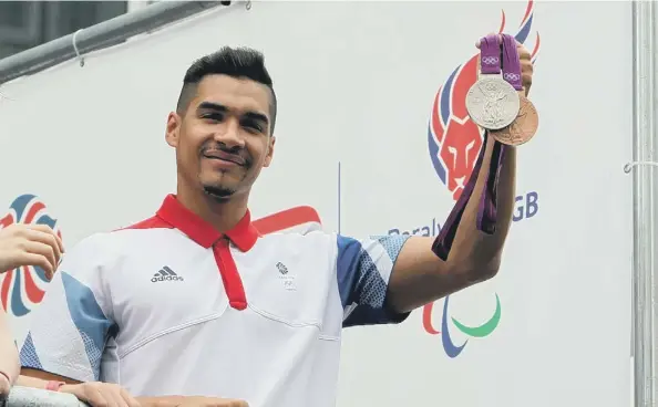  ?? ?? Louis Smith with his Olympic medals.