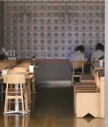  ?? Yonhap ?? People dine in a dark restaurant during a blackout at the COEX convention center in Samseong-dong, southern Seoul, Friday.