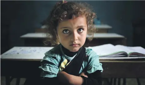  ?? AP ?? A Syrian refugee girl in a classroom at a public school in Kaitaa village, northern Lebanon