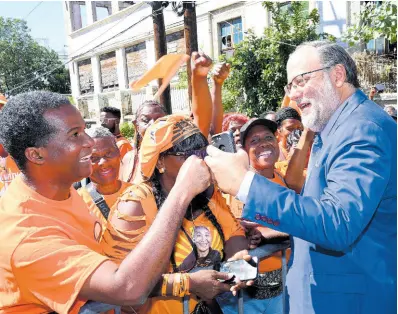  ?? ?? St Andrew Southern Member of Parliament and Opposition Leader Mark Golding greets People’s National Party supporters.