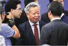  ?? Reuters ?? Allaying concerns AIIB president-elect Jin Liqun (centre) says China holds de facto veto power based on a function of GDP, but this voting power will drop as more countries join the lender.