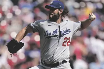  ?? BRYAN WOOLSTON/AP ?? LOS ANGELES DODGERS STARTING PITCHER CLAYTON KERSHAW (22) delivers during the first inning of a game against the Cincinnati Reds in Cincinnati Sunday.