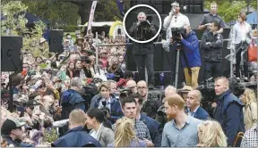  ??  ?? This is one of literally thousands of photos taken by Wendy Merrick on the day Prince Harry and Meghan came to town – this one includes fellow Dubbo Photo News photograph­er Mel Pocknall (circled) on the media stand opposite. PHOTO: DUBBO PHOTO NEWS.