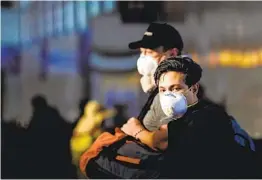  ?? KENT NISHIMURA LOS ANGELES TIMES ?? Travelers make their way Wednesday through the Tom Bradley Internatio­nal Terminal at Los Angeles Internatio­nal Airport.