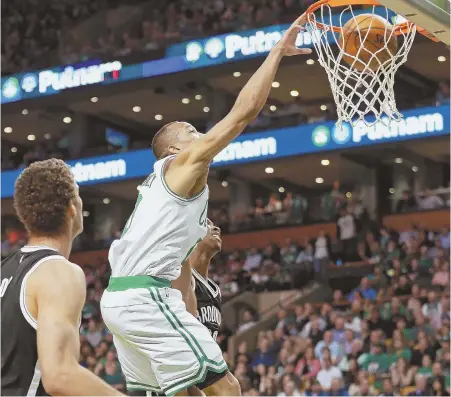  ?? STAFF PHOTO BY MATT WEST ?? HAMMER TIME: Avery Bradley finishes off a dunk during the Celtics’ 114-105 victory over the Nets last night at the Garden.