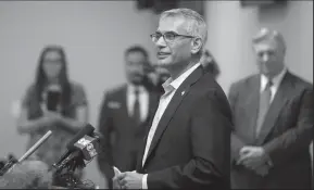  ?? AMANDA MCCOY/FORT WORTH STAR-TELEGRAM ?? Dr. Shahid Shafi addresses the press after a meeting of the Tarrant County Republican Party rejected an effort to remove him as vice-chairman on Thursday in Richland Hills, Texas.