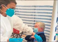  ?? Contribute­d photo ?? Human Service Director Bethany Zaros gave First Selectman Kevin Moynihan his vaccine at Lapham Center in Waveny Park in New Canaan on Feb. 10.