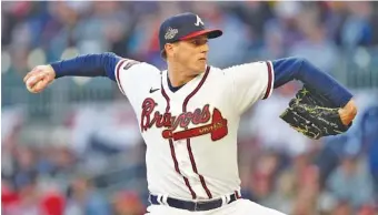  ?? AP PHOTO/JOHN BAZEMORE ?? Atlanta Braves starter Kyle Wright pitches against the visiting Cincinnati Reds on Saturday night. Wright allowed two hits in six innings to help the Braves to a 2-1 victory.