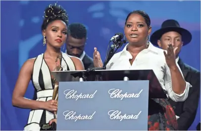  ?? CHRIS PIZZELLO, INVISION, VIA AP ?? Octavia Spencer speaks for the cast of Hidden Figures, beside Janelle Monáe, who said the film “serves as a reminder of what we can do when we get rid of ‘isms.’ ”
