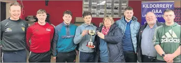  ?? ?? The winning team from Glanworth, consisting of Peter, Stephen and Thomas Condon and Sean Finn, all Kildorrery related, receiving the trophy from Helen Hartnett.
