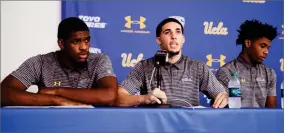  ?? AP PHOTO BY JAE C. HONG ?? Flanked by teammates Cody Riley, left, and Jalen Hill, UCLA basketball player LiAngelo Ball reads his statement during a news conference at UCLA Wednesday in Los Angeles. The three players were detained in Hangzhou following allegation­s of shopliftin­g last week before a game against Georgia Tech in Shanghai.