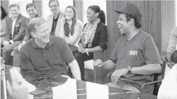  ?? AP ?? NFL Commission­er Roger Goodell, left, and Jay-Z laugh during a news conference on Wednesday at Roc Nation in New York.