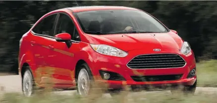  ?? Ford ?? Inside the 2014 Fiesta’s handsome exterior are more luxury and big-car features than before.