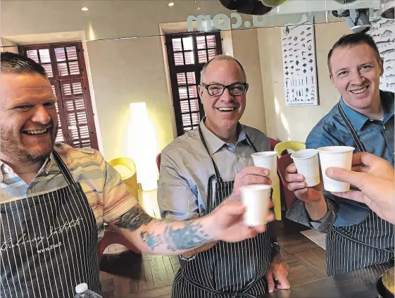  ?? SPECIAL TO THE ST. CATHARINES STANDARD ?? Ravine Vineyard Chef Ross Midgley is flanked by fellow chefs Matthew DeMille, left, and Michael Wilson at the Scuola di Alta Cucina e Pastcceria IFSE in Turin, Italy, during a recent trip hosted by the Italian Chamber of Commerce of Ontario and the...