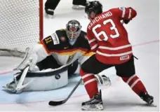  ?? ALEXANDER NEMENOV/AFP/GETTY IMAGES ?? Team Canada’s Brad Marchand is denied by Germany goalie Timo Pielmeier during world championsh­ip play Thursday in Russia.