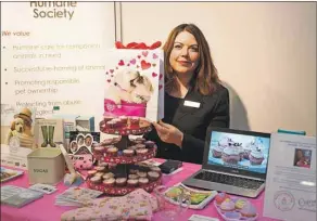  ?? BRIAN MCINNIS/THE GUARDIAN ?? Jennifer Harkness, developeme­nt co-ordinator with the P.E.I. Humane Society, was at a recent Greater Charlottet­own and Area Chamber of Commerce business mixer to promote National Cupcake Day Feb. 29. All proceeds from the event go to the humane...