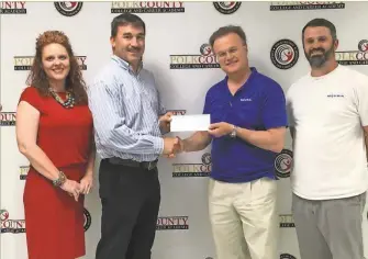  ??  ?? From left: Dr. Katie Thomas, College and Career Academy CEO, Matt Hayden, welding instructor, Mark Utzinger and Cody Nichols of Miura contribute­d $10,000 to the College and Career Academy for the welding program.