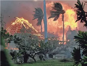  ?? ?? The hall of the historic Waiola Church in Lahaina and the nearby Lahaina Hongwanji Mission are engulfed in flames along Wainee Street on Aug. 8.