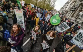  ?? CHRIS RATCLIFFE/GETTY IMAGES FILE PHOTO ?? Protesters took to the streets as part of marches around the globe Nov. 29 on the eve of the UN Climate Summit in Paris. Canada will need to determine how it plans to move forward in line with commitment­s made in Paris.