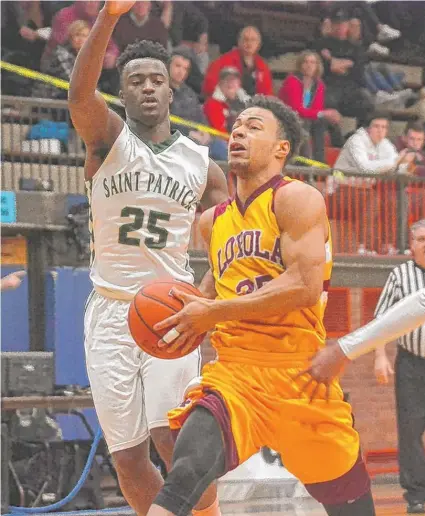  ?? | WORSOM ROBINSON/ FOR THE SUN- TIMES ?? Loyola’s Ramar Evans, who led the Ramblers with 19 points, drives to the basket against St. Patrick.